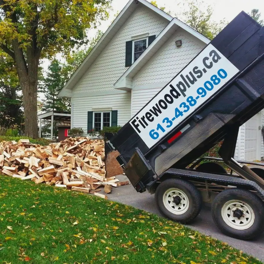 Firewood Plus delivery truck dumping a cord of firewood at a customer's home